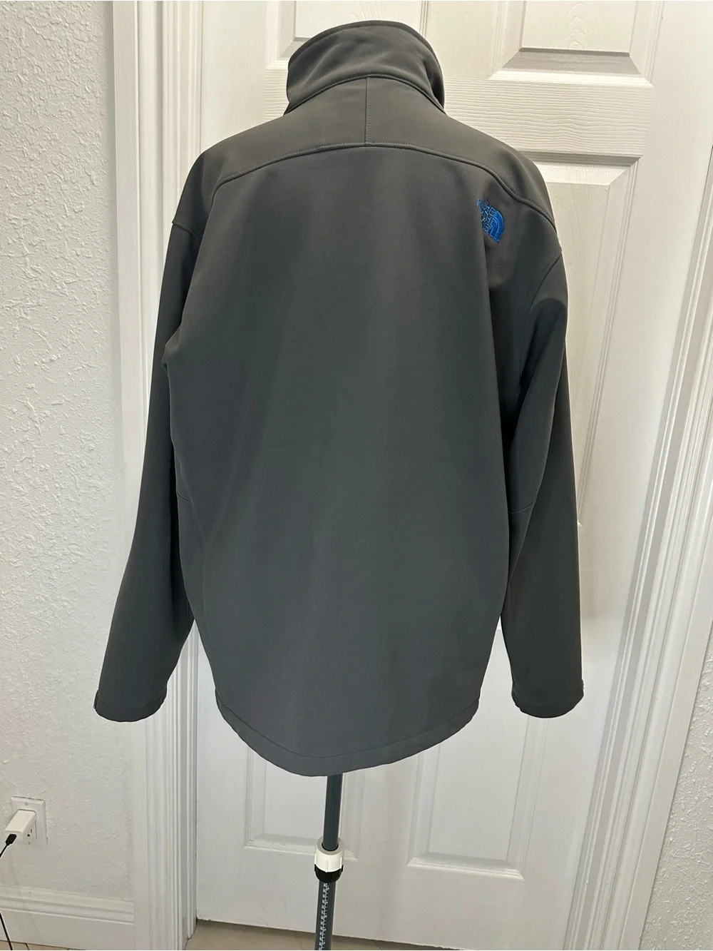 The North Face Men's Charcoal Gray Jacket with Blue Zippers